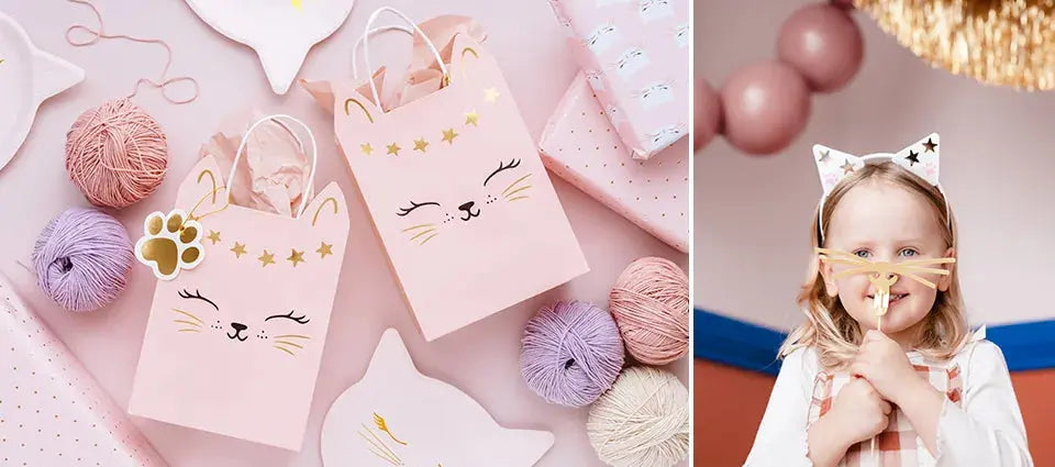 Cat party bags on flat lay with cat plates and invitations showing along with balls of yarn. Girl with cat ears headband and whiskers prop