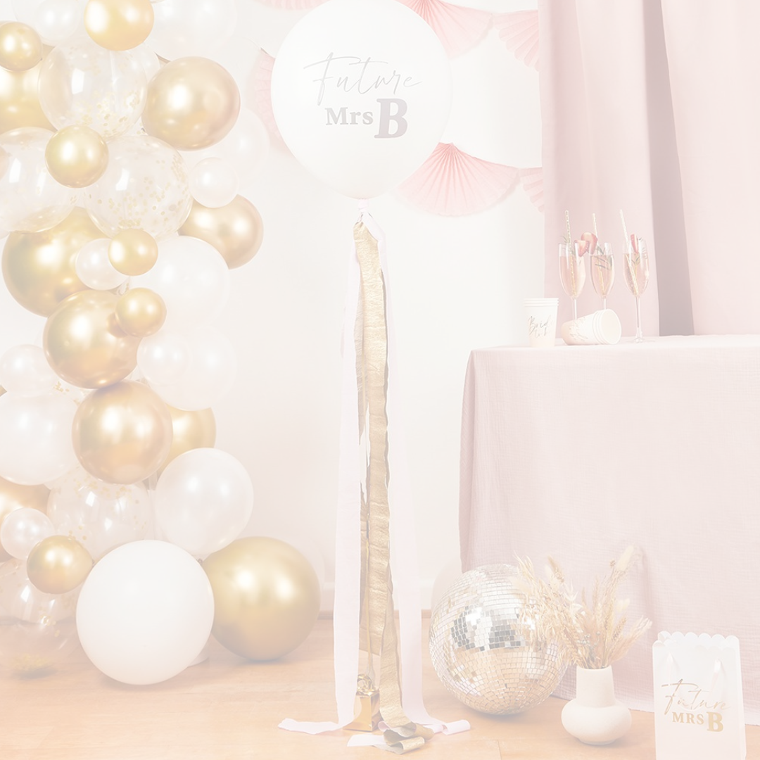 Peach and gold hen party table setting with Bride To Be plates and napkins