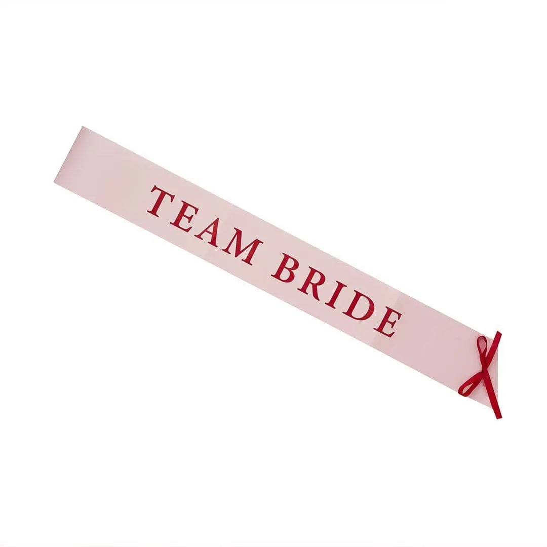 Pink & Red Team Bride Paper Sashes - She’s Tying The Knot Hen Party Accessories - Coquette Hen Do Sashes With Red Satin Ribbon - Pack of 5 - Jolie Fete UK