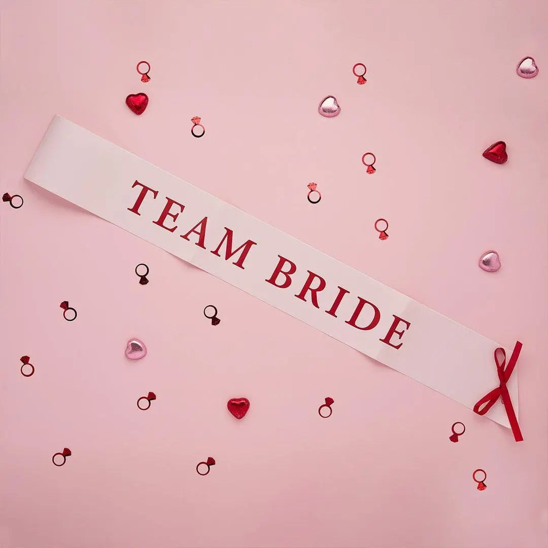 Pink & Red Team Bride Paper Sashes - She’s Tying The Knot Hen Party Accessories - Coquette Hen Do Sashes With Red Satin Ribbon - Pack of 5 - Jolie Fete UK