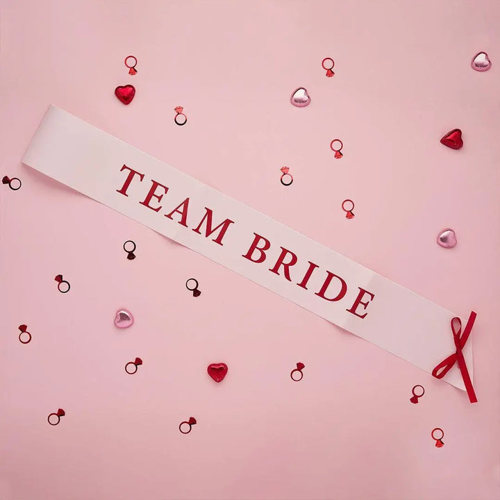 Pink & Red Team Bride Paper Sashes - She’s Tying The Knot Hen Party Accessories - Coquette Hen Do Sashes With Red Satin Ribbon - Pack of 5 - Jolie Fete UK