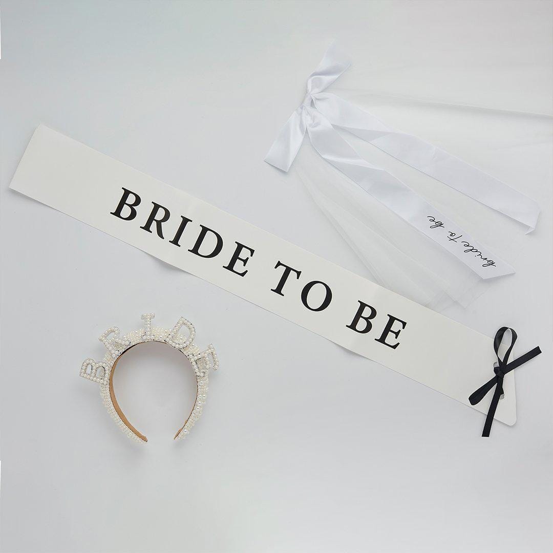 White Bride To Be Paper Sash - She’s Tying The Knot Hen Party Accessory - Coquette Bridal Shower Sash with Black Satin Ribbon - Hen Do Sash - Jolie Fete UK